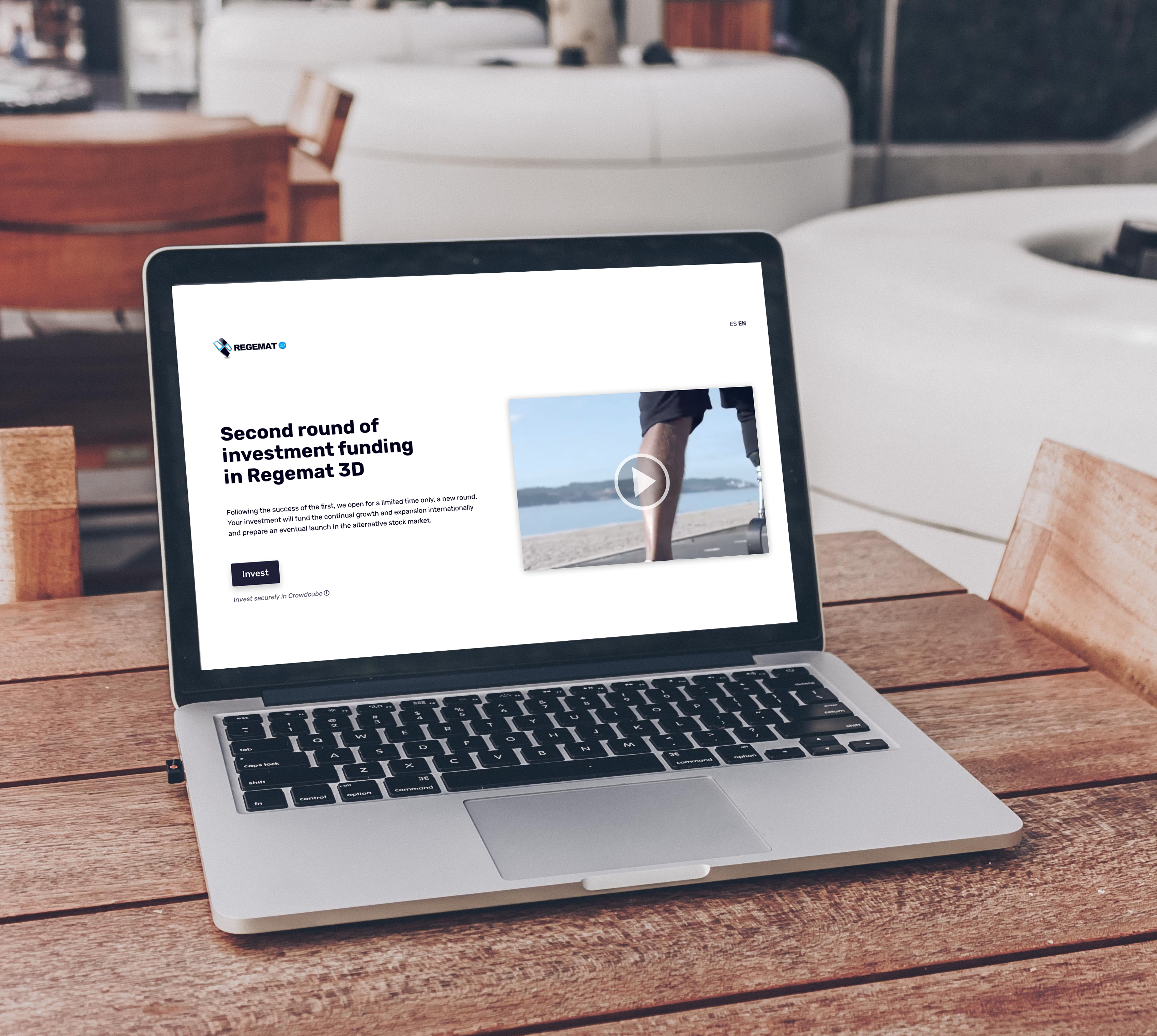 Image showing the landing page of Regemat on a table.